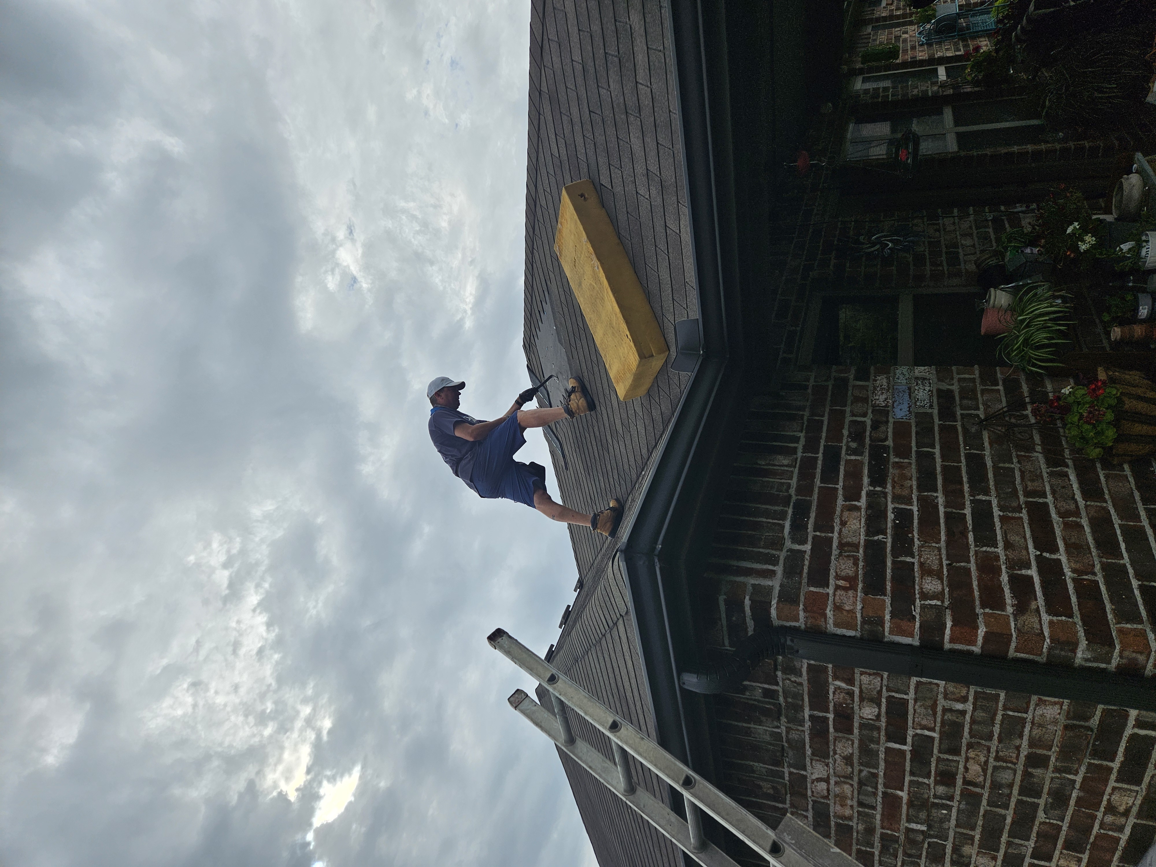 Chuck Conner on a roof working a modern project